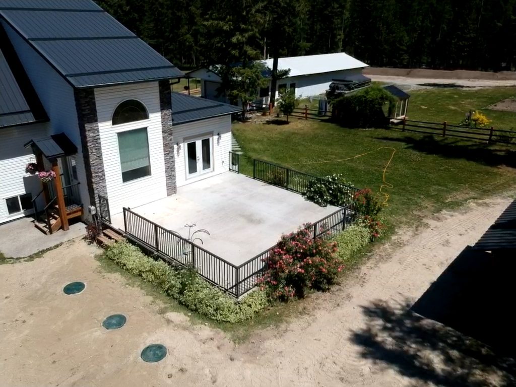 Aerial view of a rural property with a newly installed septic system